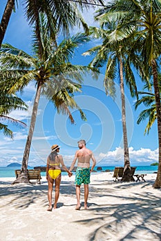 Man and women on a tropical beach in Thailand, Koh Kham Thailand Trat