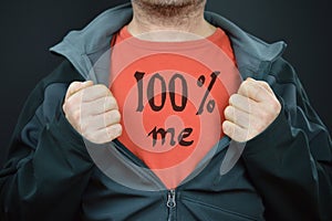 A man with the words 100% me on his red t-shirt