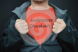 Man with words undercover christian on red t-shirt