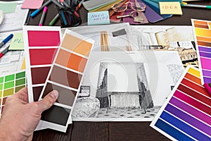 Man work with Color palette and house apartament sketch for creative design home photo