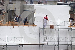 Man at work, construction of new building in progress