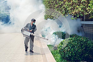 Man work fogging to eliminate mosquito and zika virus