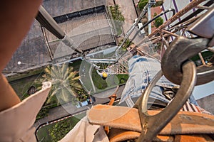 The man work on high antenna pole
