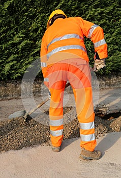 man at work with high visibility orange clothing