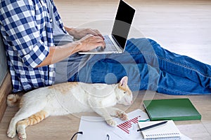 A man is work at home or studying online via computer.