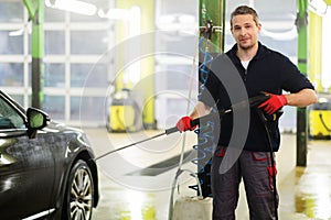 Man worker on a car wash