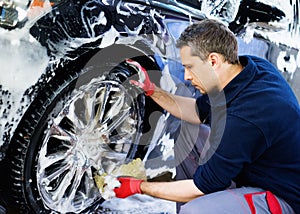 Man worker on a car wash