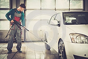 Man worker on a car wash