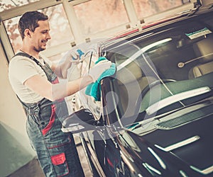 Man worker on a car wash