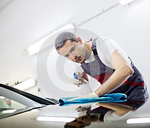 Man worker on a car wash