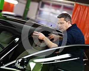 Man worker on a car wash