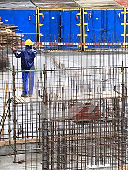 Man, worker in construction building