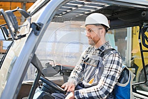Man worker at forklift driver happy working in industry factory logistic ship