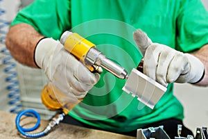 Man worker hold screwdriver machine and use it
