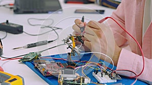 Man Worker with Multimeter Measuring Instrument in Office.