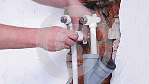 man worker takes measurements during the installation of a warm floor