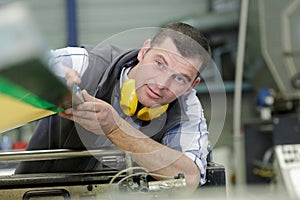 man worker working on tool machine in factory