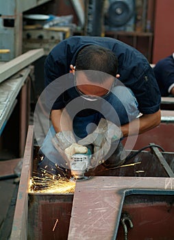 Man working with angle grinder