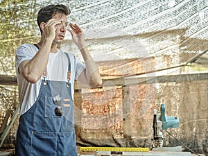 The Man working as carpenters in theirs carpentry workshop