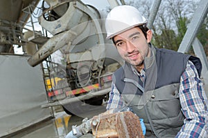 Man working behind cement truck