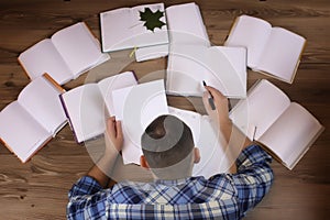 Man working with book on the floor