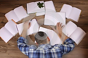 Man working with book on the floor