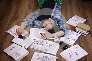 Man working with book on the floor