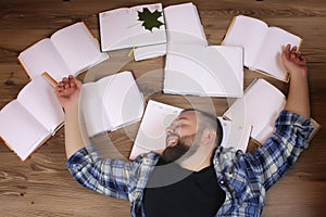 Man working with book on the floor