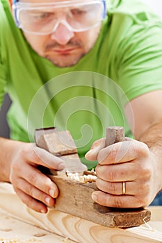 Man working with carpenter's plane