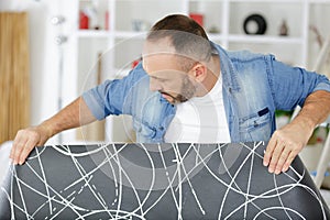 man working on carpet floor