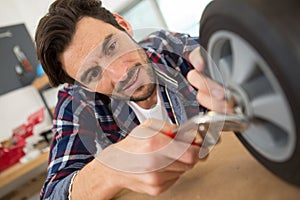 Man working on caster wheel