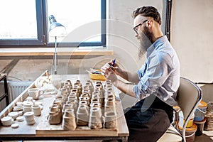 Man working with ceramics at the pottery