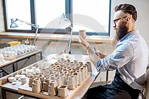 Man working with ceramics at the pottery