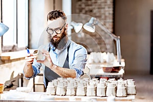 Man working with ceramics at the pottery