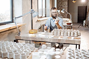 Man working with ceramics at the pottery