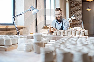Man working with ceramics at the pottery