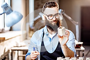 Man working with ceramics at the pottery