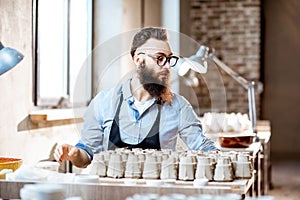 Man working with ceramics at the pottery