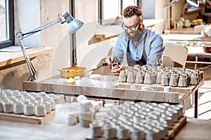 Man working with ceramics at the pottery