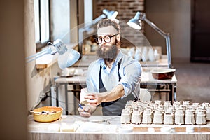 Man working with ceramics at the pottery