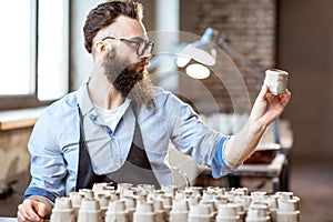 Man working with ceramics at the pottery