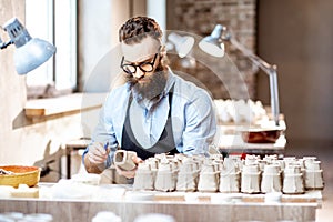 Man working with ceramics at the pottery