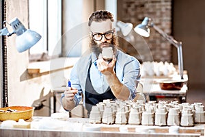 Man working with ceramics at the pottery