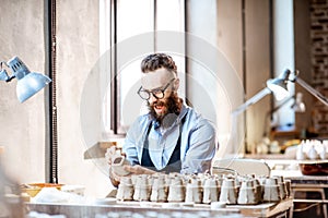 Man working with ceramics at the pottery