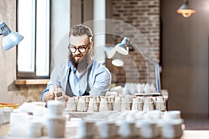 Man working with ceramics at the pottery
