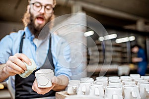 Man working with ceramics at the pottery