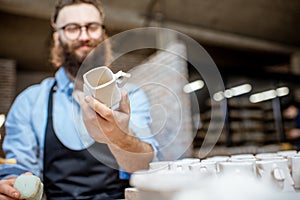 Man working with ceramics at the pottery