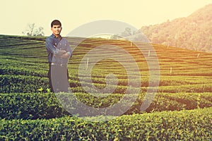 Man working on checking farm in his tea garden in the morning