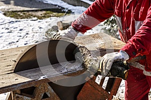 Man working with circular saw blade