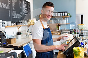 Man working in coffee shop